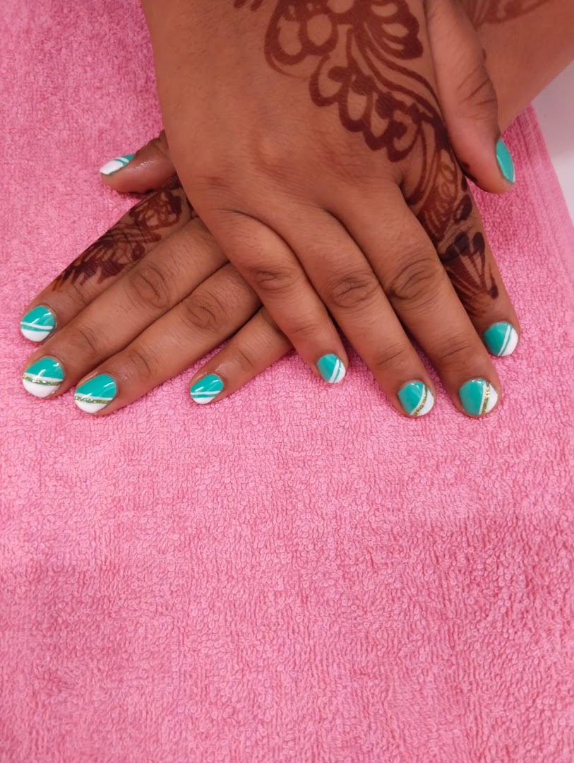 Teal reverse-French manicure from Vibha's nail bar.
